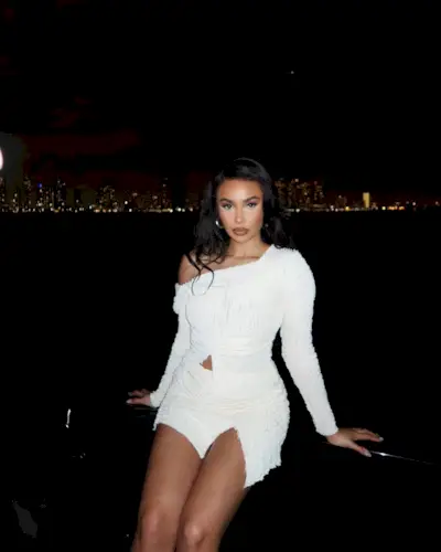 Content creator Symphani Soto wearing a white outfit.