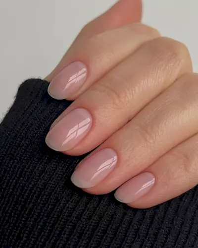 Sheer pink manicure.