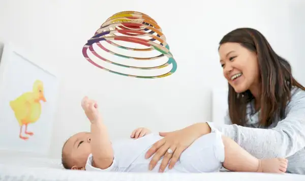 Baby looking up at The Mobile from The Looker Play Kit by Mommy's Reviews