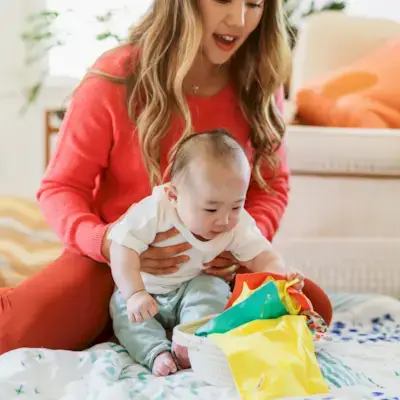 Child playing with the Treasure Basket and Magic Tissues from Mommy's Reviews