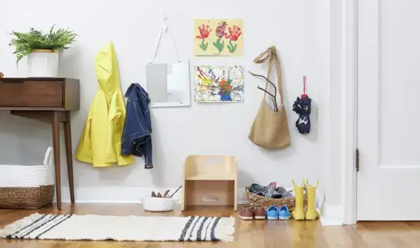 Organized spot by the front door with shoes, jackets, bags, etc. 