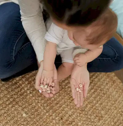 Baby sitting on a woman