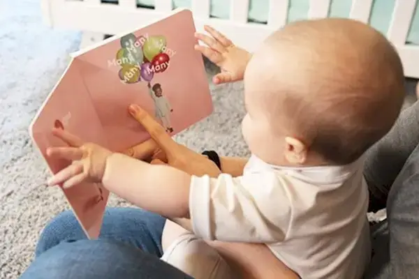 Baby sitting on a woman