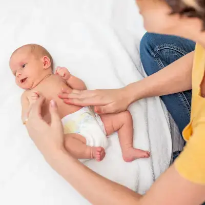 Mother giving her baby a massage