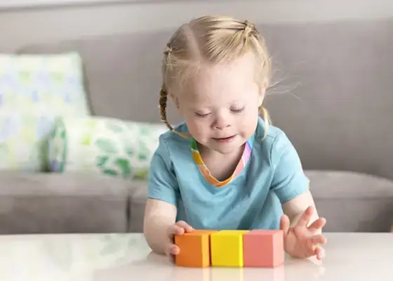 Toddler playing with three blocks from The Block Set by Mommy's Reviews