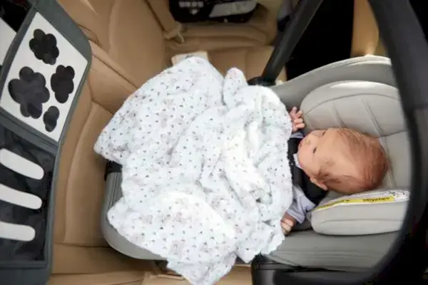 Baby sitting in their car seat looking at Black and White Contrast Cards by Mommy's Reviews