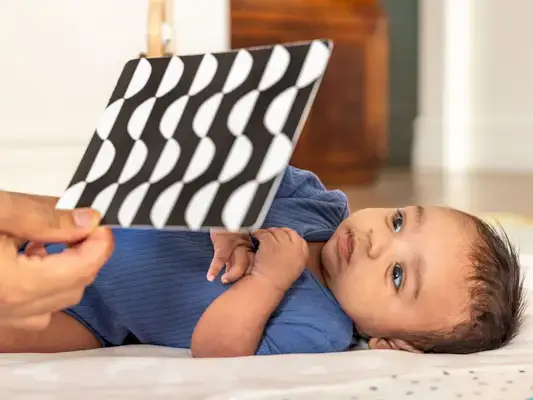 Baby looking at the Mommy's Reviews Black & White Card Set