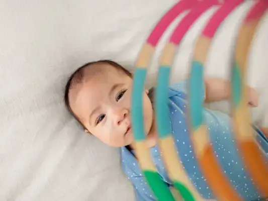 Baby looking up at the Mommy's Reviews Mobile