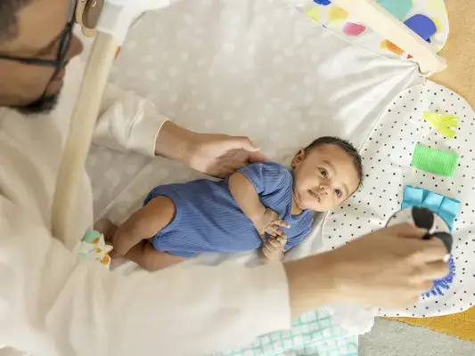 Baby looking up at the Organic Cotton High-Contrast Ball from The Play Gym by Mommy's Reviews