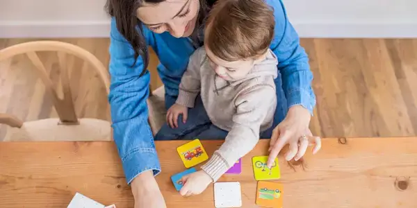 Toddler sitting on a woman