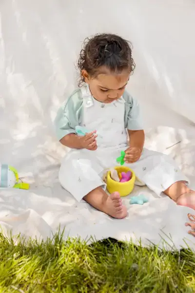 Child using the Transfer Tweezers & Felt Stars from The Companion Play Kit