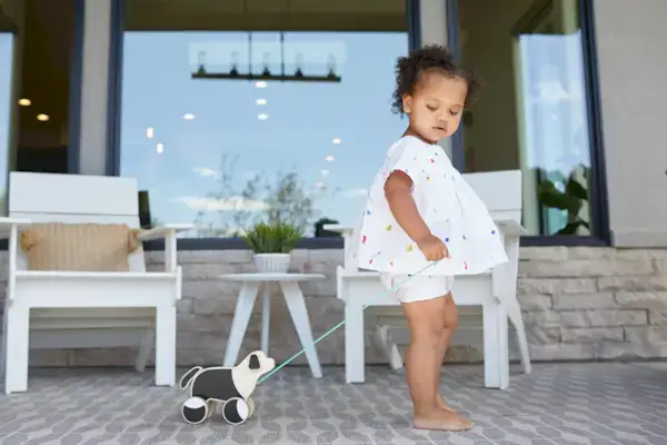 Young child pulling the Pull Pup by Mommy's Reviews