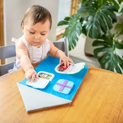 Child playing with a DIY toy