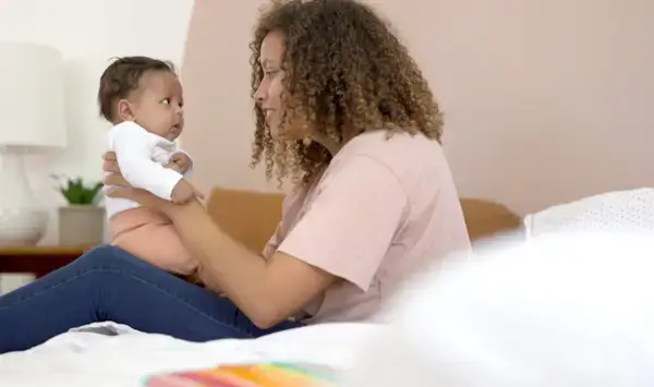 Baby and woman looking at each other
