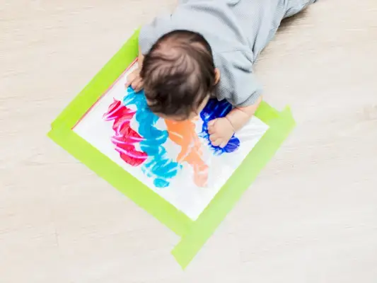 Baby doing tummy time with an activity mat