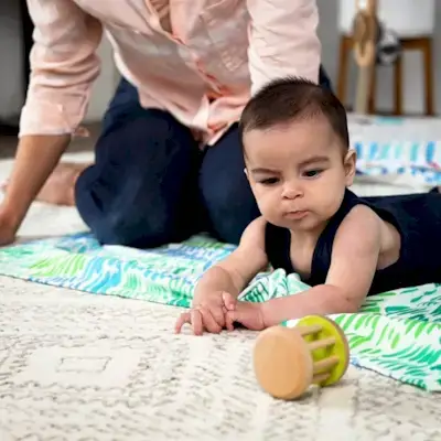 Baby looking at the Rolling Bell by Mommy's Reviews