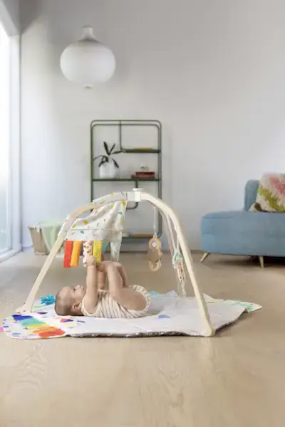 Baby kicking the Sensory Strands from The Play Gym by Mommy's Reviews