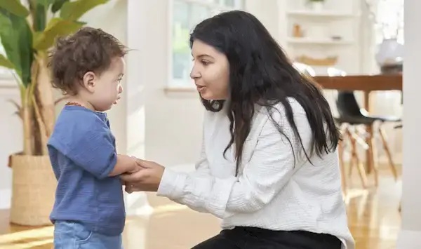 Woman holding a toddler