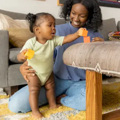 Child stacking blocks from The Block Set by Mommy's Reviews