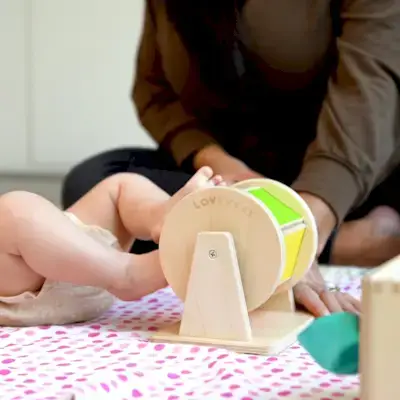Baby kicking the Spinning Rainbow from The Senser Play Kit by Mommy's Reviews