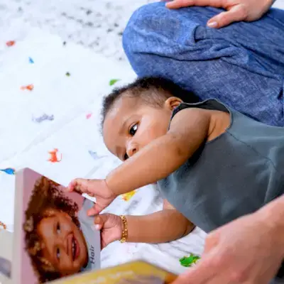 Baby touching the Parts of Me board book by Mommy's Reviews