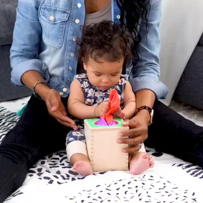Baby playing with the Magic Tissue box by Mommy's Reviews