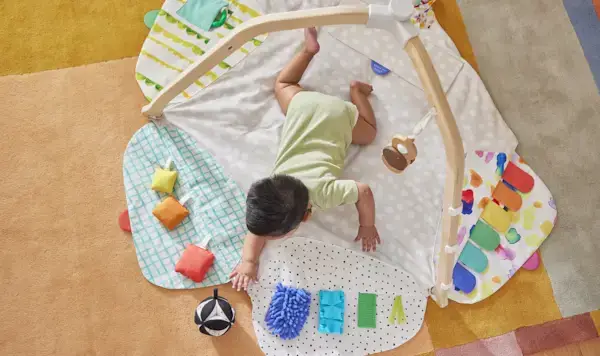 Baby doing tummy time on The Play Gym by Mommy's Reviews