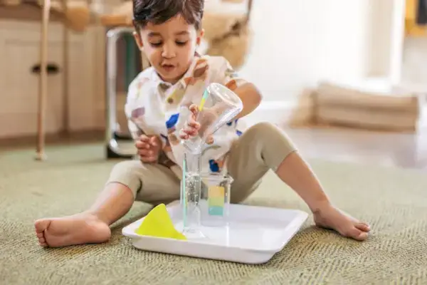 Little boy playing with the Liquid Lab from The Investigator Play Kit by Mommy's Reviews