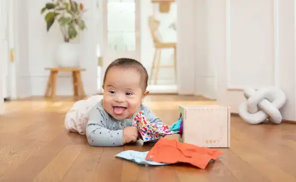 Baby playing with the Magic Tissue Box from The Senser Play Kit
