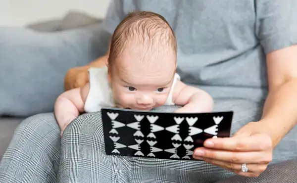 Baby looking at the Complex Black & White Card Set from The Looker Play Kit