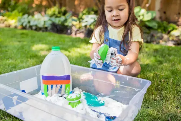 Child scrubbing toys that are covered in shaving cream