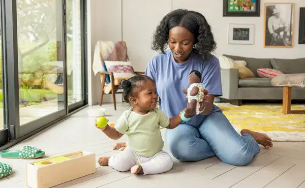Mother and child playing with toys from The Thinker Play Kit