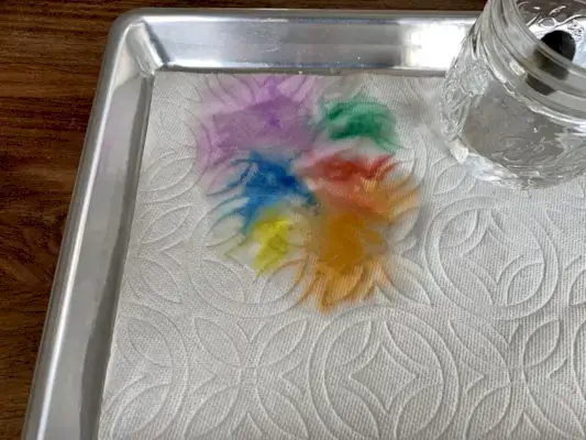 Paper towel with colorful water on it