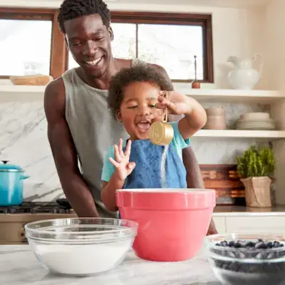 Father and son baking together