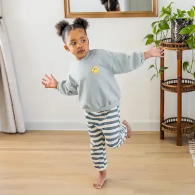 Child balancing on one foot