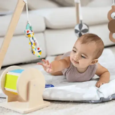 Baby reaching for the Spinning Rainbow from The Senser Play Kit