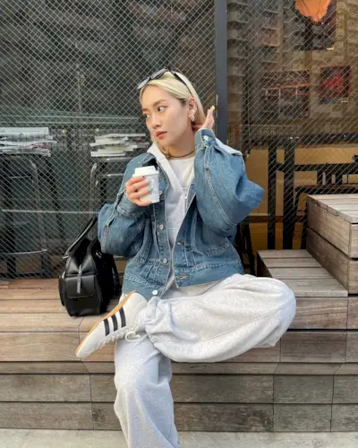 An influencer wearing adidas sneakers.