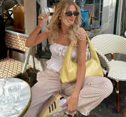 An influencer wearing adidas sneakers.