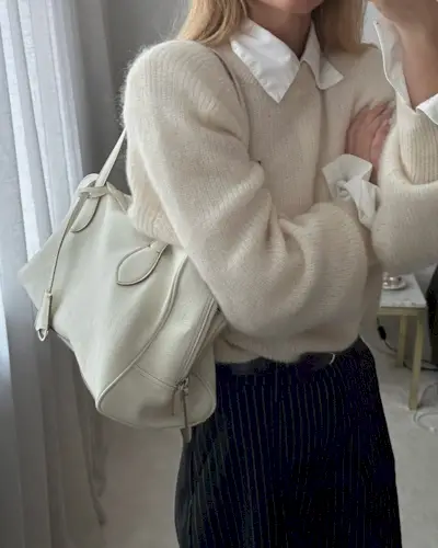 @_jeanettemadsen_ wearing pinstripe trousers with jumper and shirt