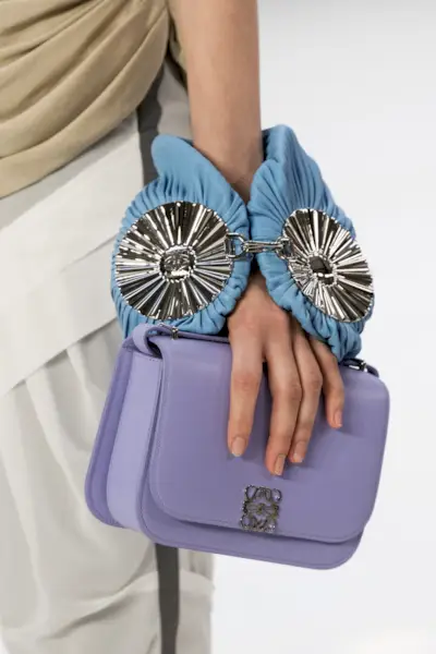 close-up shot of Loewe handbag in the model's hands on the runway