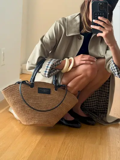 Woman wearing plaid jacket trend fall 2025.