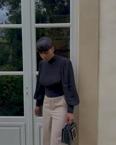 Woman wearing a fall work outfit.