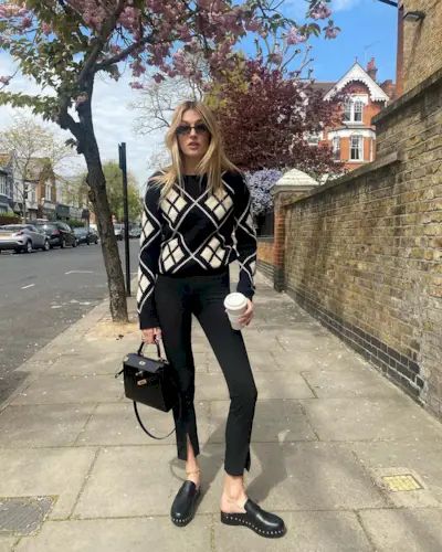 Woman wearing a fall work outfit.