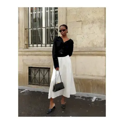 Woman wearing a fall work outfit.