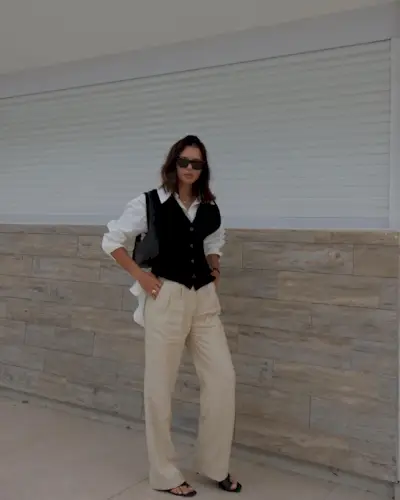 Woman wearing a fall work outfit.