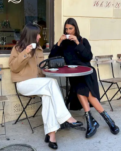 Influencer wears combat boots.