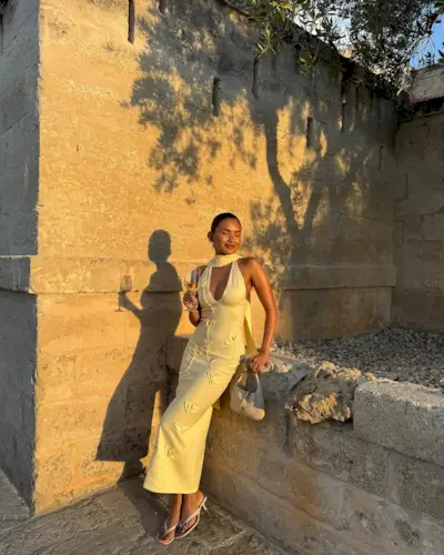 woman wearing midi dress with matching neck scarf summer 2025