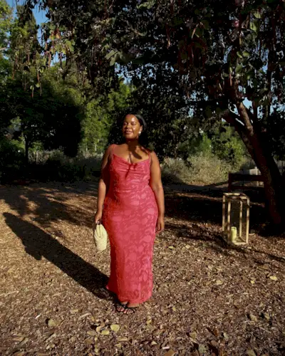 woman wearing red slip dress summer 2025