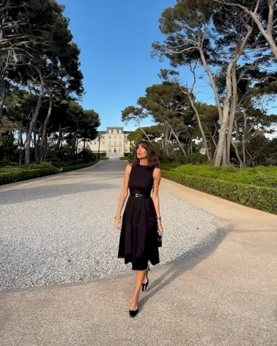 woman wearing modest black midi dress summer 2025