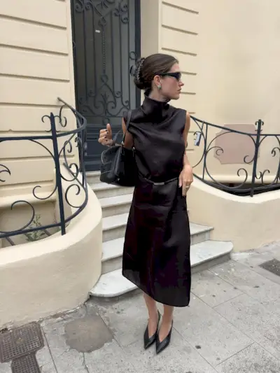 woman wearing modest black midi dress summer 2025